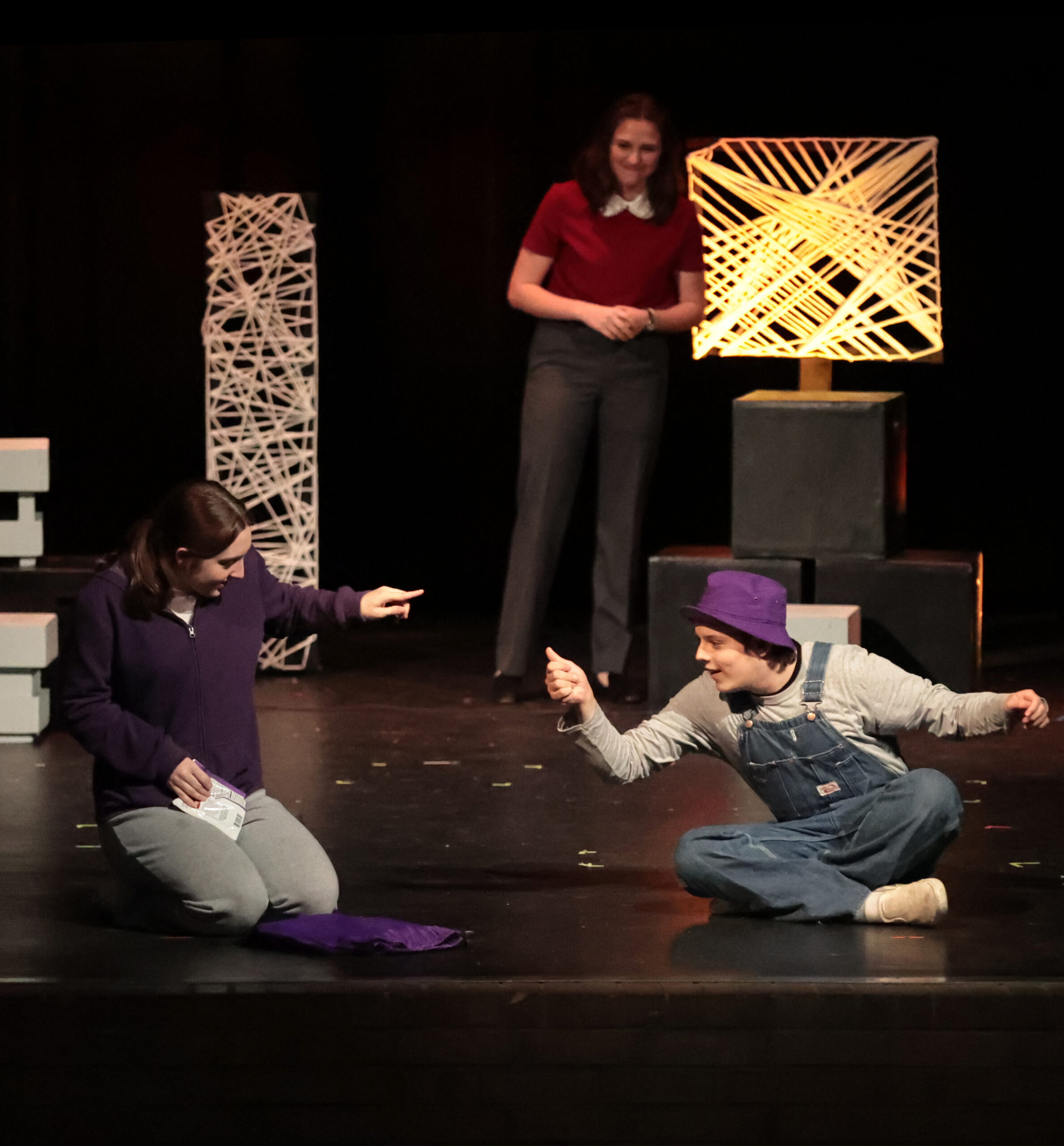 photo of students on stage in a play