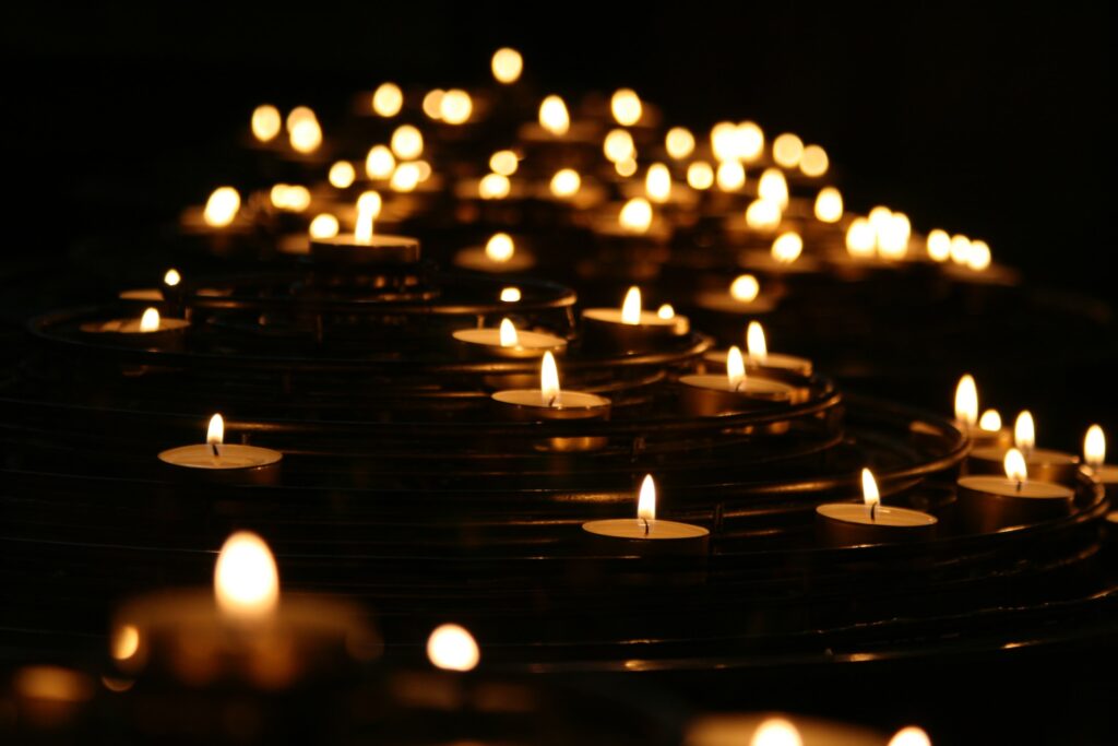 Rows of lit candles