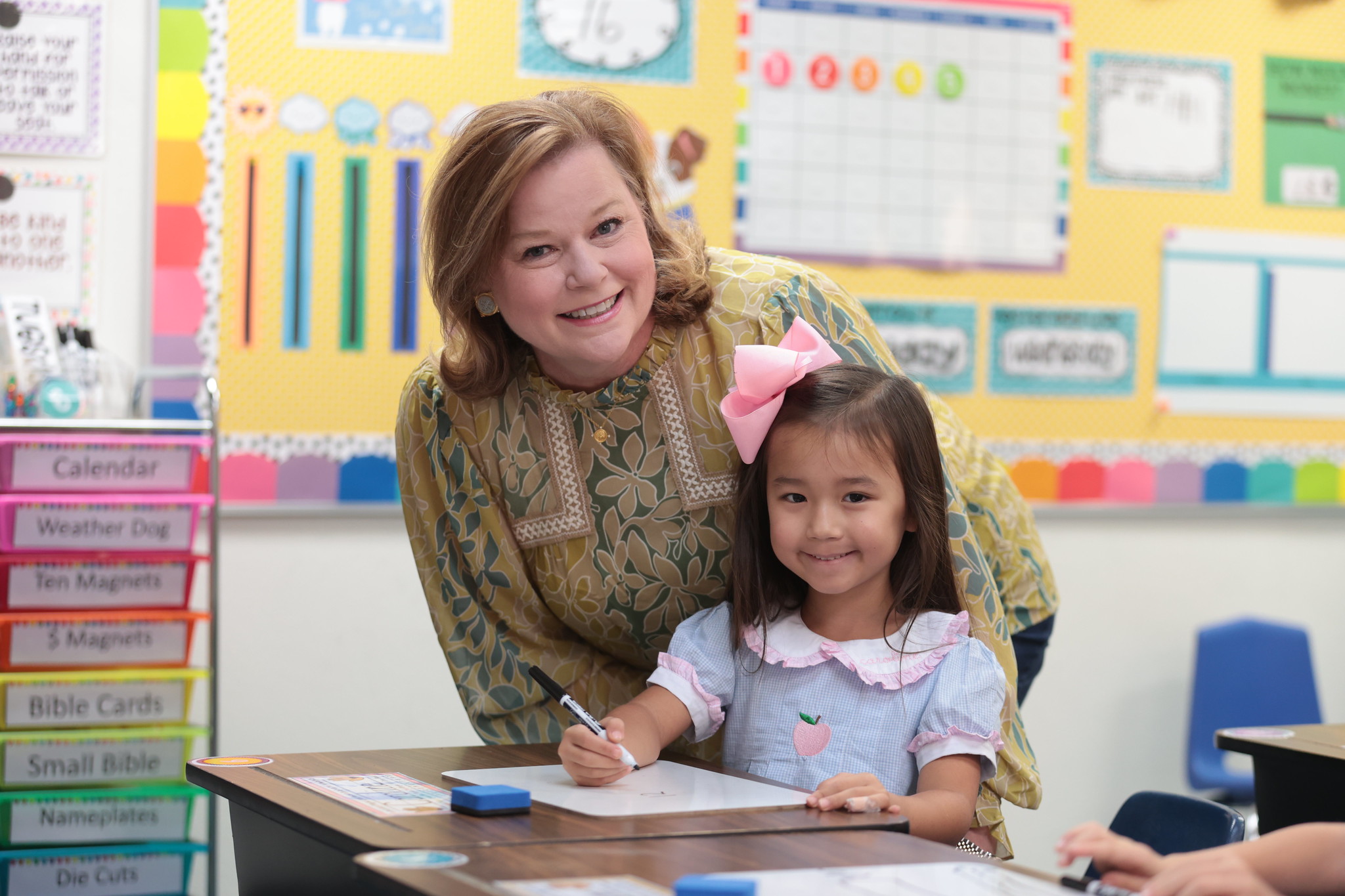 A young boy and a girl in costume participating in a play