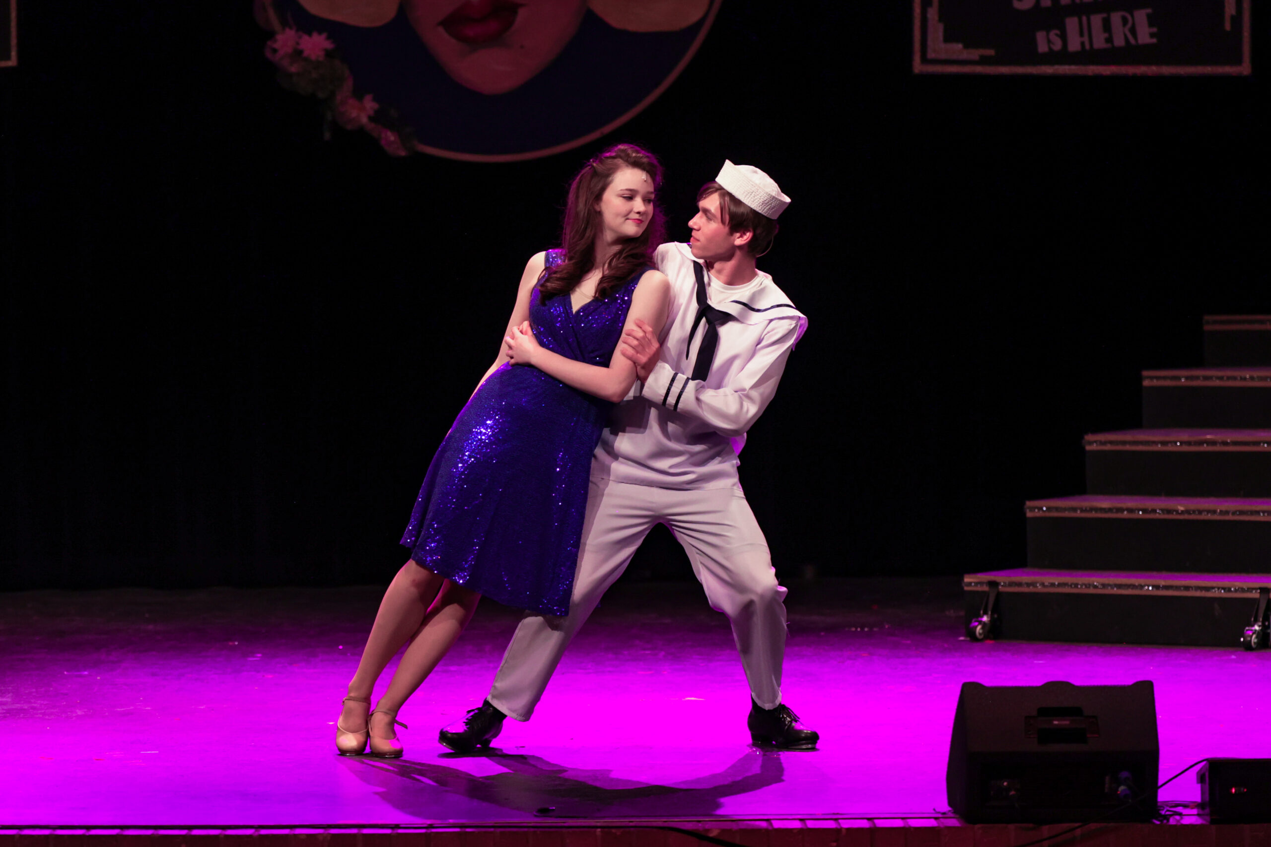 photo of students on stage in a play